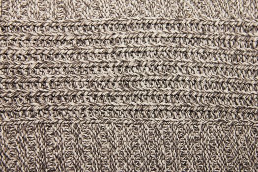 gray knitted wool knitted warm clothes for the winter fabric texture background