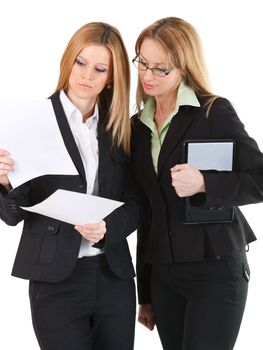 Young, successful businesswomen looking at a document