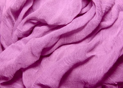 fabric texture cotton and silk crumpled blue folds lying on a table background