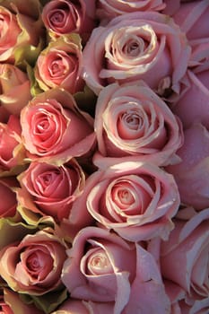 Pink roses in a floral wedding arrangement