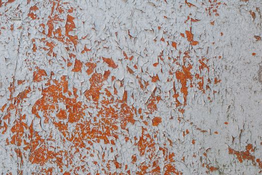 texture of surface with remnants of old paint that has dried and cracked under the influence of weather