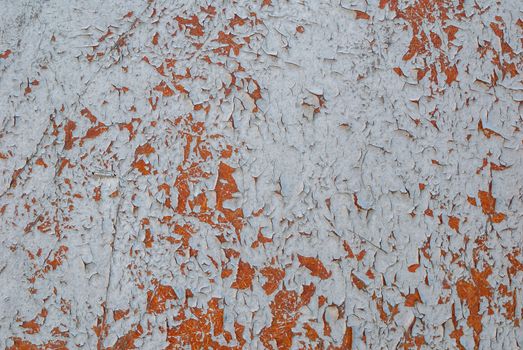 texture of surface with remnants of old paint that has dried and cracked under the influence of weather