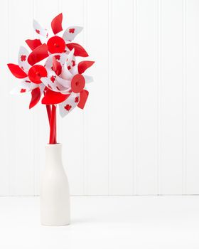 Pinwheels with a Canadian motif arranged in a vase like flowers.