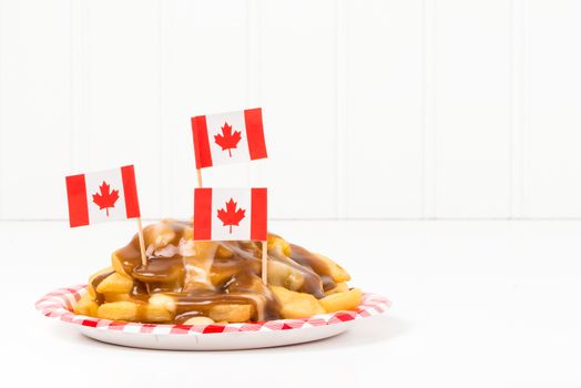A plate of poutine, a unique dish that originated from the province of Quebec.
