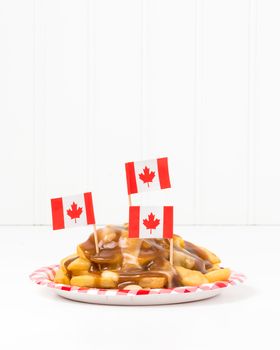 Plate of poutine, a unique Canadian fast food originating from the province of Quebec.