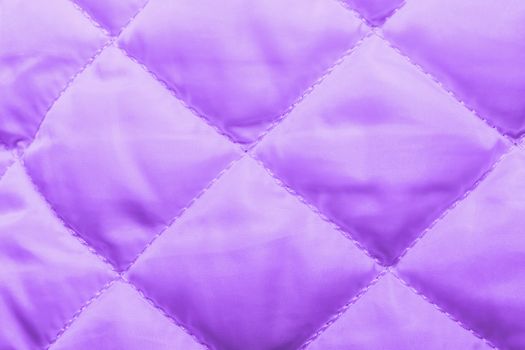 quilted fabric texture of violet color for hammering, backgrounds and textures