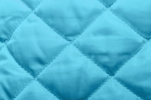quilted fabric texture of blue color for hammering, backgrounds and textures