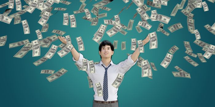 Asian Man Catching Money Falling From the Sky in US Dollars