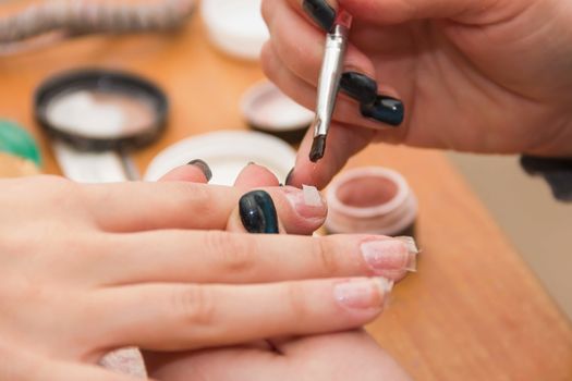 build artificial nails, manicures, artificial nails correction, the industry of beauty and nail care, beauty salons, soft focus