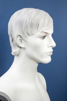 Figurine Head, monochrome on the blue background