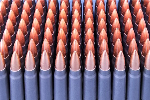 Live ammunition for automatic weapons or rifles ranked closeup. 