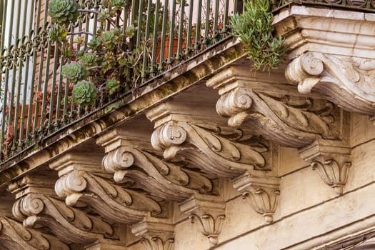 detail of a baroque balcony in Acireale, Sicily - Italy