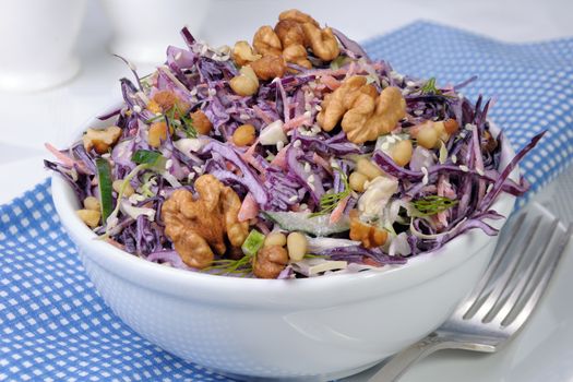 salad of shredded cabbage with nuts in milk sauce