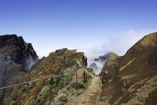 blue sky and brown rocks at the high mountains at madeira island called pico arieiro, the top is 1818 meters above sea level