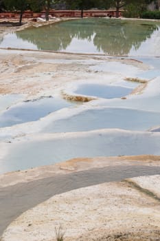 View of natural geographical formations in Pamukkale area in Turkey with travertine pools.