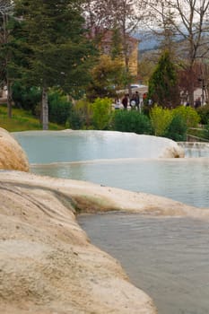 View of natural geographical formations in Pamukkale area in Turkey with travertine pools.