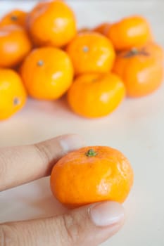 Small oranges grown in Thailand.