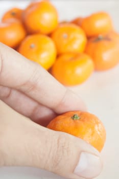 Small oranges grown in Thailand.
