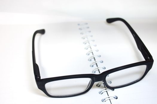 books and glasses symbolizing the concept of reading
