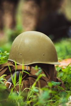 the military helmet and backpack ammunition closeup