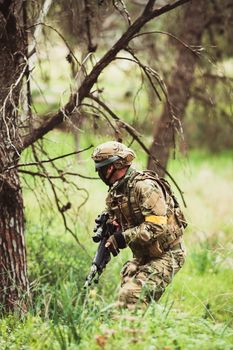 men in military uniform with weapon on a mission