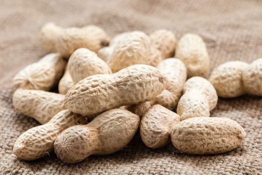 groundnut in the skin close-up on vintage background