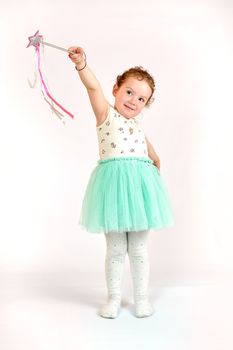 Fashion little girl in green dress, in catwalk model pose, stock photo. Image 01