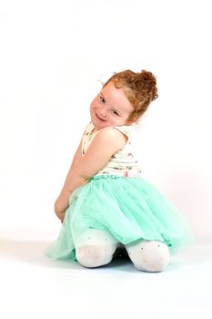 Fashion little girl in green dress, in catwalk model pose, stock photo. Image 06