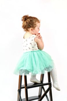Fashion little girl in green dress, in catwalk model pose, stock photo. Image 12