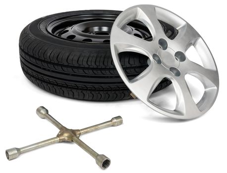Car service. Car tyre with wheel cap and screwdriver. Isolated