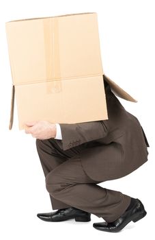 Businessman in suit wearing carton box on head isolated on white background