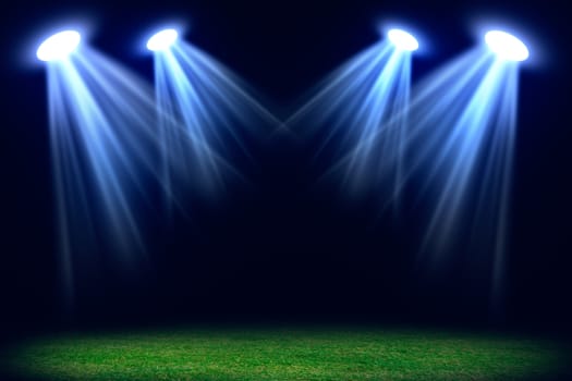 Grass field lit with bright spotlights. Abstract background for your product