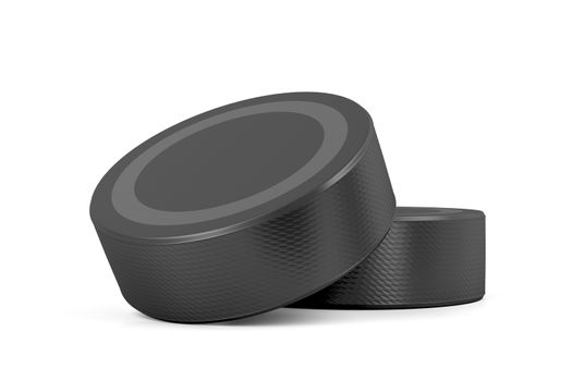 Two ice hockey pucks on white background