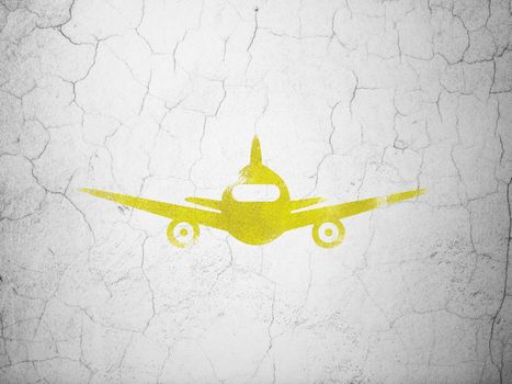 Tourism concept: Yellow Aircraft on textured concrete wall background