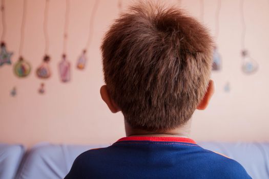 The boy's head was turned golden blonde with pink walls.