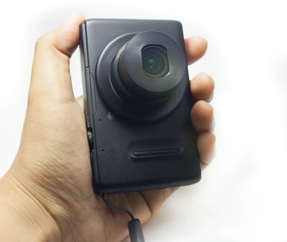 Compact digital camera in hand