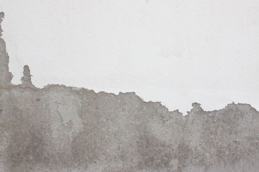 Grungy cracked white wall paint peeling off