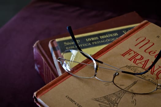 Glasses on old books