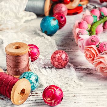 White lace,sewing thread and charming wooden bead