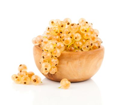 White currant fruit in a wood bowl, isolated over white background.