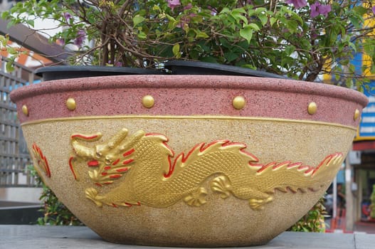 Beautiful of flowerpot dragon pattern was placed at roadside in Thailand.