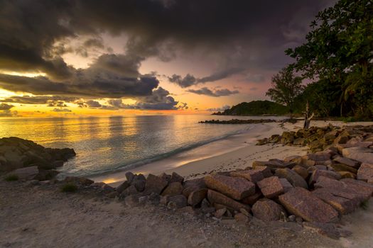 Beautiful view of Anse Kerlan beach at the sunset, Praslin, Seychelles