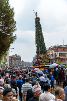 PATAN, NEPAL - MAY 10, 2016: God of Rain Rato Machhindranath chariot festival. Rato Machhindranath is worshiped as the god of rain. The chariot is pulled through the street of Patan for about a month.