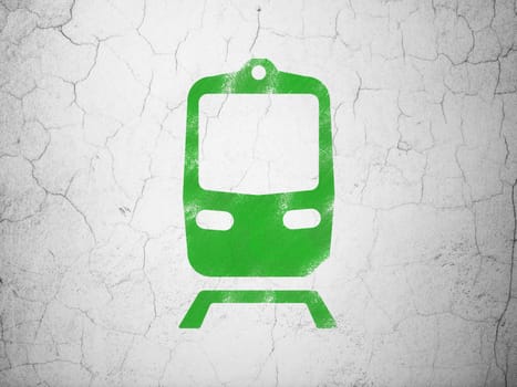 Travel concept: Green Train on textured concrete wall background