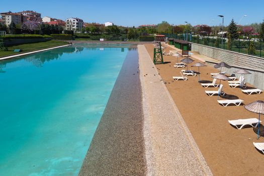 View of artificial coast made along Porsuk River in Eskisehir on bright blue sky background.