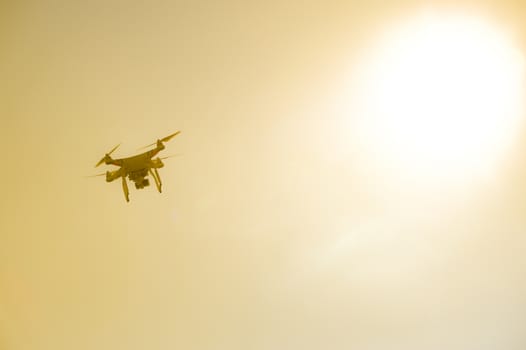 Drone with camera flying against sky, France