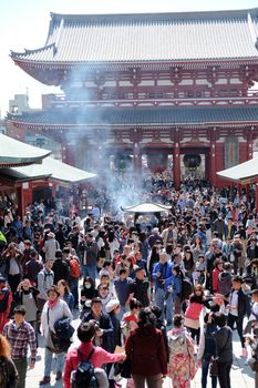 TOKYO, JAPAN - MARCH 29, 2016: unidentified people visit sensoji temple in Tokyo on 29 March 2016.. Sensoji temple is the most famous attraction in Asakusa, Tokyo, Japan