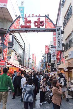 TOKYO, JAPAN - MARCH 29, 2016 : Crowded and busy Ameyoko shopping street on 29 March 2016.Today, various products such as clothes, bags, cosmetics, fresh fish, dried food are sold along Ameyoko.