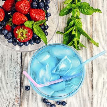 Alcohol in stylish blue color glass glass on long stalk