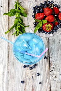 Alcohol in stylish blue color glass glass on long stalk